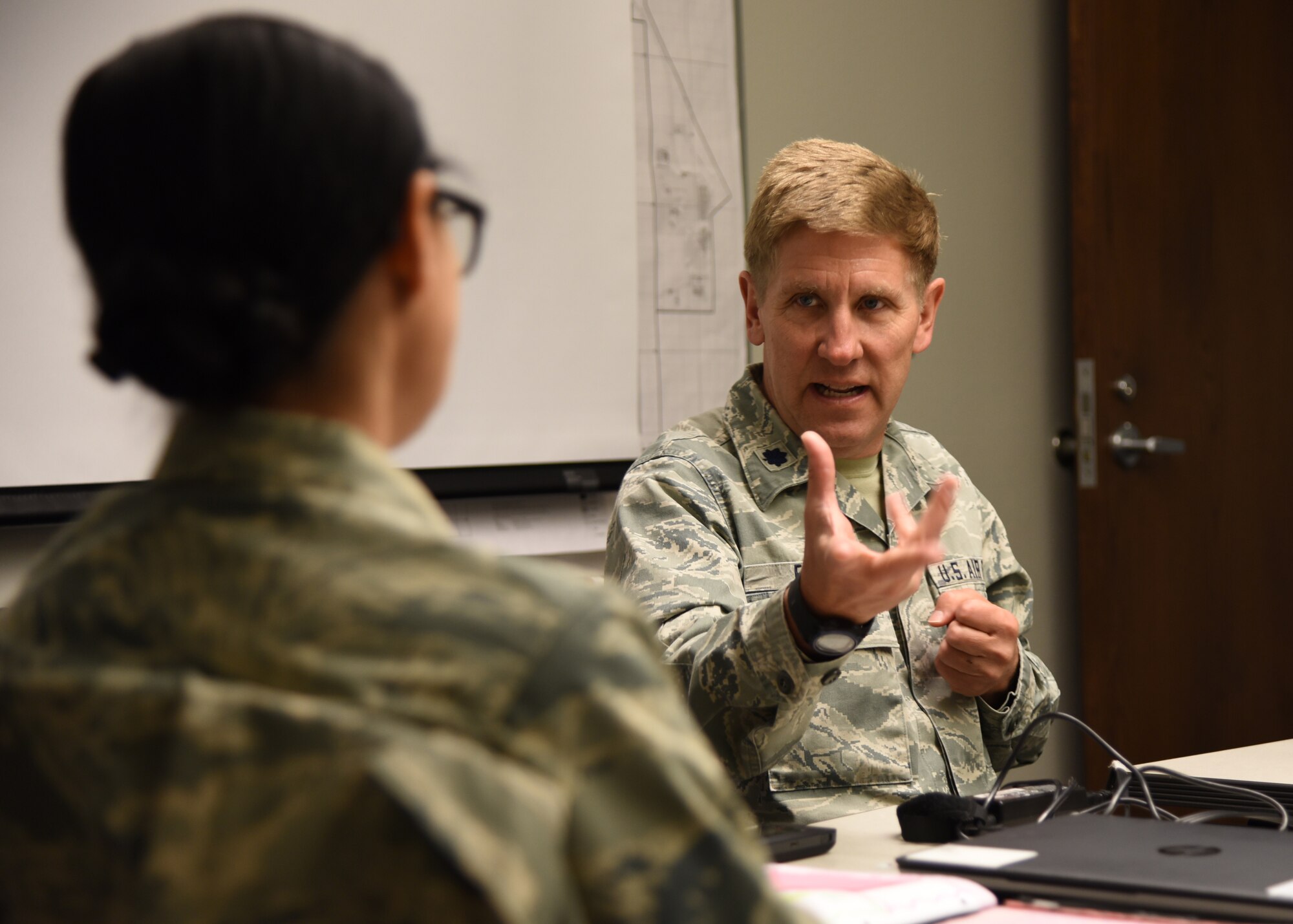 Lt. Col. Alan Flolo, 302nd Airlift Wing Inspector General Inspections, and Maj. Lisa Breal, 403rd Wing IGI, discusses the status of their programs during a meeting at Peterson Air Force Base, Colorado, April 24, 2018. The 403rd Wing Inspector General Inspections Division and 403rd Wing Process Manager visited their counterparts at Peterson Air Force Base, Colorado, to learn more about how the two offices can work together to be more efficient and improve the unit. (U.S. Air Force photo/Maj. Marnee A.C. Losurdo)