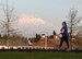 A participant of the 62nd Airlift Wing Sexual Assault Prevention and Response Office’s Take Back the Night 5K walk/run walks around a track at Joint Base Lewis-McChord, Wash., April 25, 2018. The purpose of the 5K was to raise awareness about sexual assault prevention as April is Sexual Assault Awareness and Prevention Month. (U.S. Air Force photo by Senior Airman Tryphena Mayhugh)