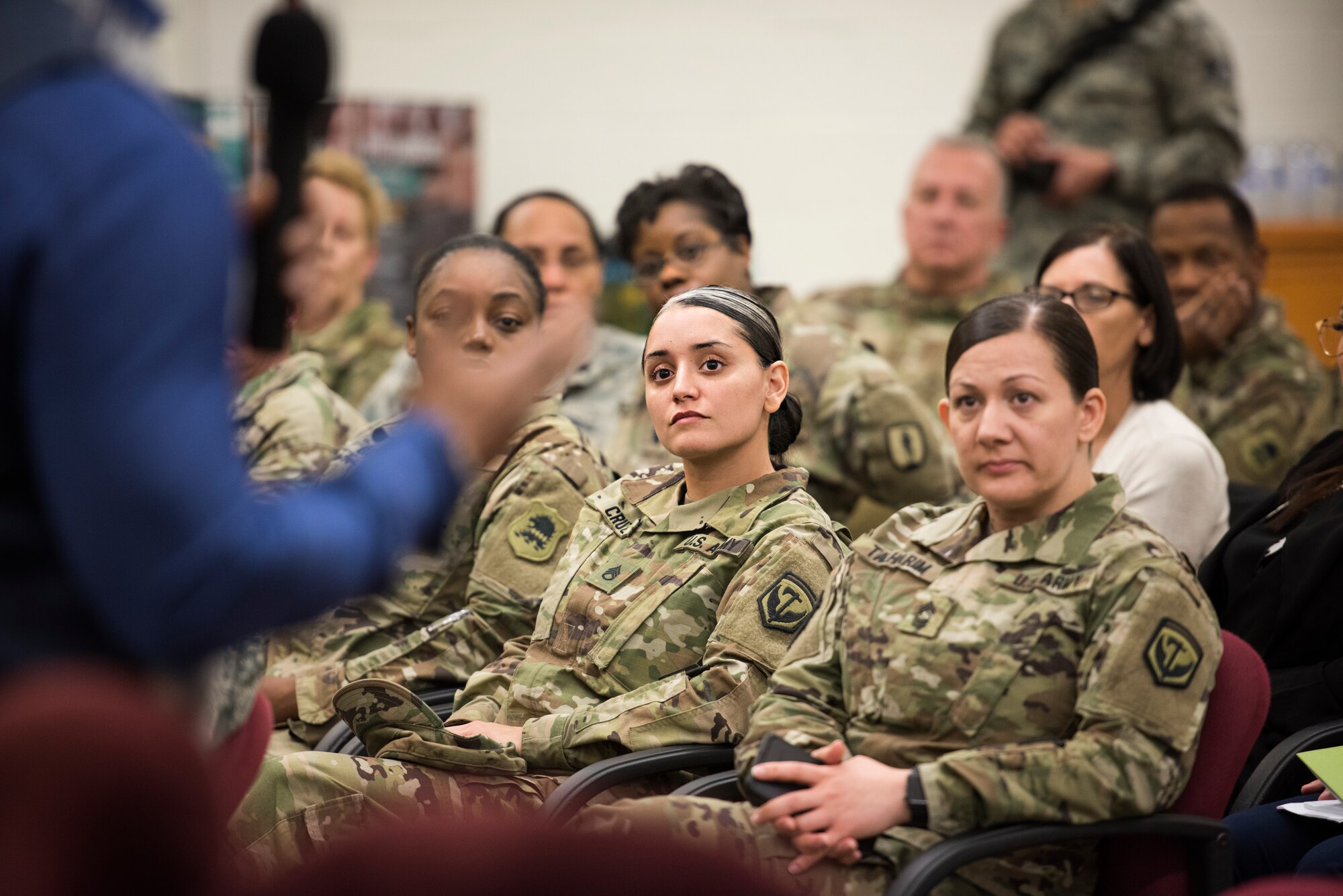 Audience members listen to Tony Porter, co-founder of "A Call to Men," a violence-prevention organization, during a speech given in honor of Sexual Assault Awareness Prevention Month April 17, 2018 at Joint Base McGuire-Dix-Lakehurst, N.J. Porter discussed ways the community could change social norms and curb behaviors that marginalize women and girls. (U.S. Air Force photo by Tech. Sgt. Katherine Spessa)
