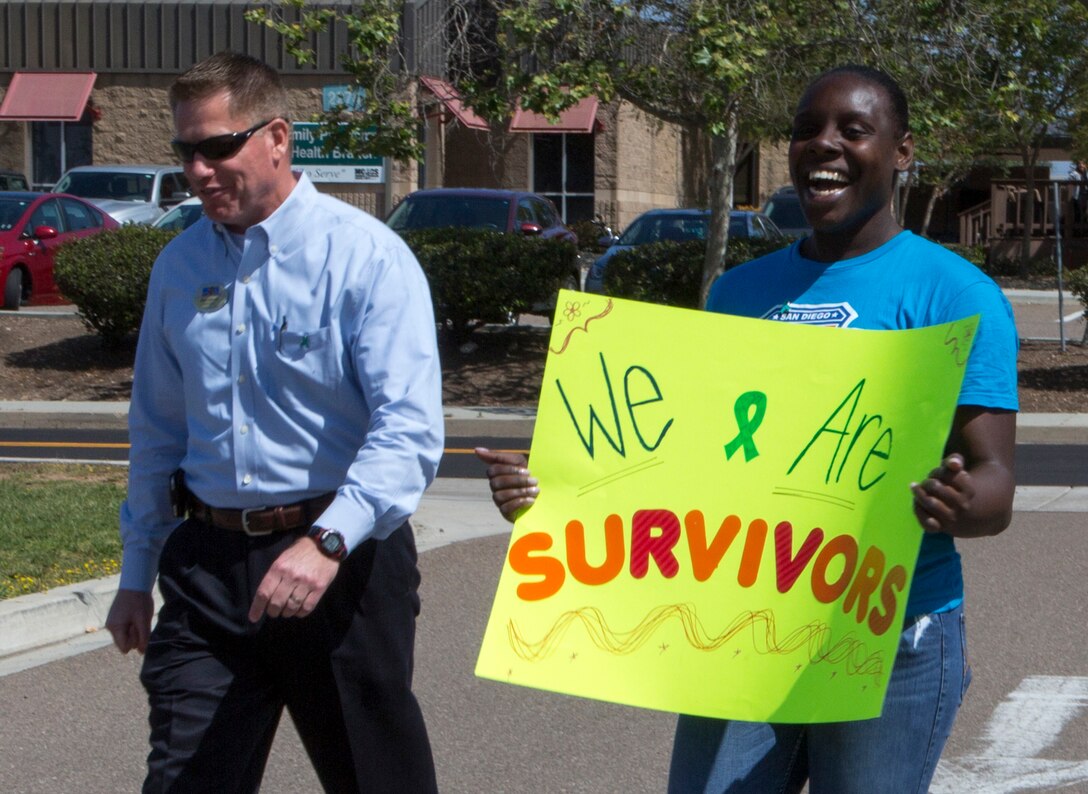 Marines, Sailors and civilians participate in “Forward March,” an annual Sexual Assault Prevention and Response (SAPR) walk on Marine Corps Air Station Miramar, Calif., April 26. SAPR staff and unit leaders at MCAS Miramar recognized Sexual Assault Awareness Month by hosting a series of events and organizing displays to raise awareness about sexual assault and highlight the available resources. (U.S. Marine Corps photo by Cpl. Becky Calhoun/Released)