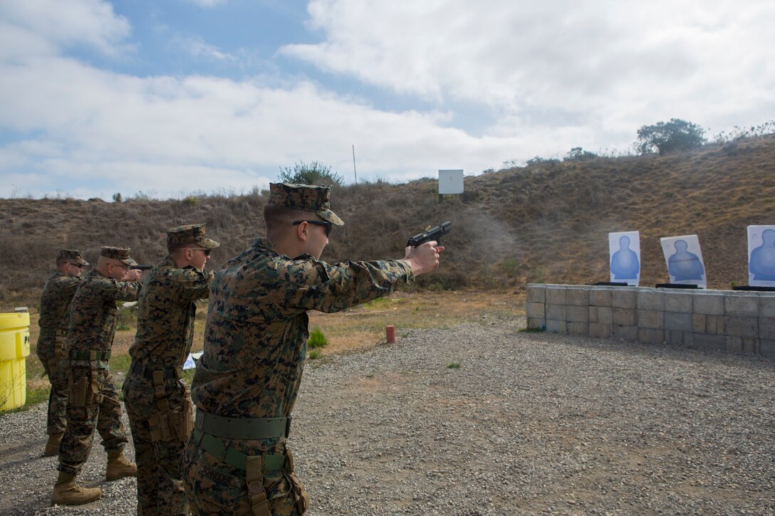 Marines with Headquarters and Headquarters Squadron (H&HS) participate in a pistol marksmanship competition as part of the “Warrior Challenge” at Marine Corps Air Station Miramar, Calif., April 26. The “Warrior Challenge” is a monthly competition between all of the sections in H&HS to promote camaraderie and a healthy competitive spirit. (Marine Corps photo by Cpl. Daniel Auvert/released)