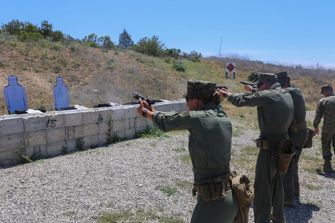 Marines with the Special Reaction Team, Headquarters and Headquarters Squadron (H&HS) participate in a pistol marksmanship competition as part of the “Warrior Challenge” at Marine Corps Air Station Miramar, Calif., April 26. The “Warrior Challenge” is a monthly competition between all of the sections in H&HS to promote camaraderie and a healthy competitive spirit. (U.S Marine Corps photo by Cpl. Daniel Auvert.)