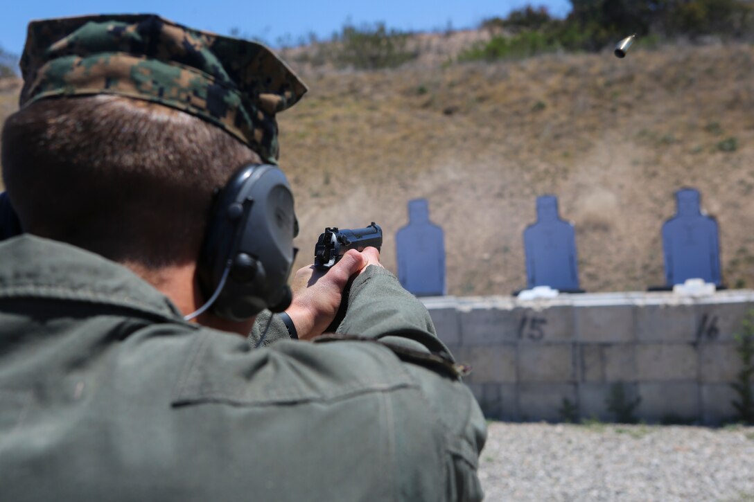 A Marine with the Special Reaction Team, Headquarters and Headquarters Squadron (H&HS), participates in a pistol marksmanship competition as part of the “Warrior Challenge” at Marine Corps Air Station Miramar, Calif., April 26. The “Warrior Challenge” is a monthly competition between all of the sections in H&HS to promote camaraderie and a healthy competitive spirit. (U.S. Marine Corps photo by Cpl. Daniel Auvert/Released)