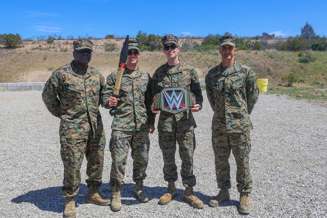 From left, Sgt. Maj. Alfred R. Broadus, sergeant major of Headquarters and Headquarters Squadron (H&HS), Cpl. Jake R. Musser, Cpl. Anthony Bartelmie, Lt. Col. Michael A. Spears, commanding officer of H&HS, pose with the trophy after winning the H&HS “Warrior Challenge” at Marine Corps Air Station Miramar, Calif., April 26. The “Warrior Challenge” is a monthly competition between all of the sections in H&HS to promote camaraderie and a healthy competitive spirit. (U.S. Marine Corps photo by Cpl. Daniel Auvert/Released)