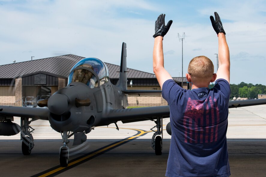 Joe Johnson, Sierra Nevada Corporation (SNC) avionics technician, taxis an A-29 Super Tucano, April 26, 2018, at Moody Air Force Base, Ga. The 81st Fighter Squadron received the aircraft to help continue the Afghan light air support training mission, which ultimately provides Afghan pilots with the capabilities of finding, tracking, and attacking targets either on their own or in support of ground forces. The aircraft will be used by the Afghan Air Force for close-air attack, air interdiction, escort and armed reconnaissance. SNC is an American privately held electronic systems provider and systems integrator, and are the primary technicians and pilot instructors of the A-29s. (U.S. Air Force photo by Airman 1st Class Erick Requadt)