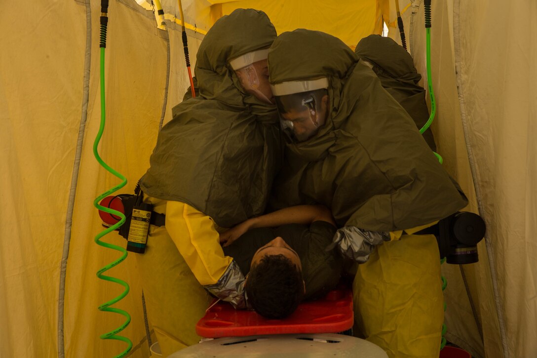 Sailors and civilian medical personnel, with Naval Hospital Camp Pendleton, treat notional victims during exercise Semper Durus on Marine Corps Base Camp Pendleton, Calif., April 25, 2018.  Semper Durus exercises regional command and control during crisis situations to improve response procedures and limit impact while responding to possible terrorist activity. (U.S. Marine Corps photo by Lance Cpl. Haley McMenamin)