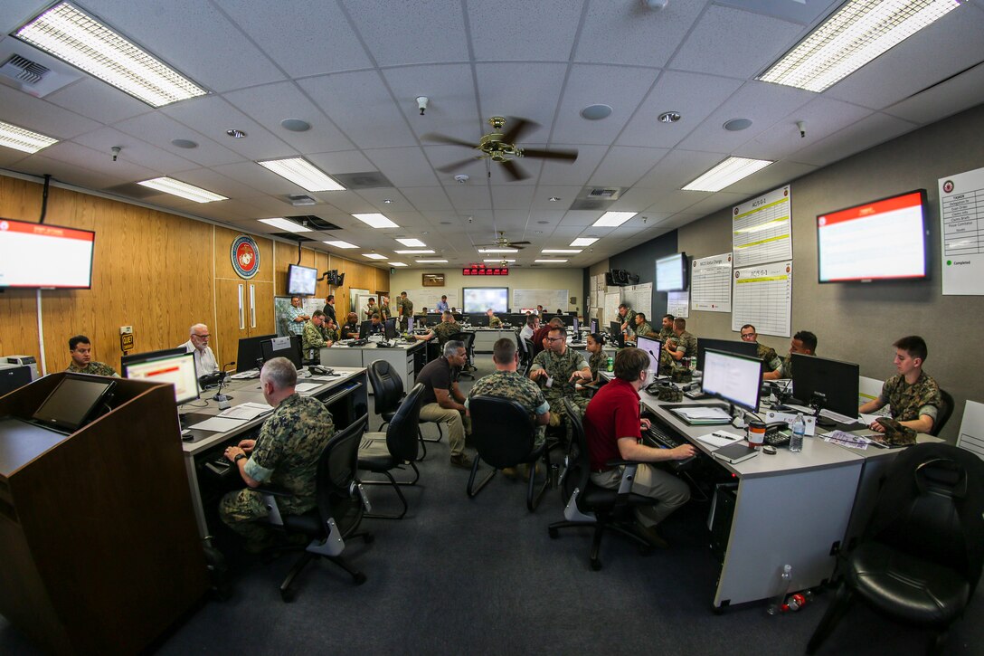 In the event of a serious emergency, an Emergency Operations Center (EOC) is established to ensure that regional command and control is performed to the highest standard. Exercise Semper Durus 2018 is an annual exercise conducted by Marine Corps Base - Camp Pendleton to improve response procedures and limit impact during a crisis situation. Representatives from various commands come together in an EOC and act as puzzle pieces, each playing their own role in building a clear picture of mission success. (U.S. Marine Corps photo by Cpl. Dylan Chagnon)