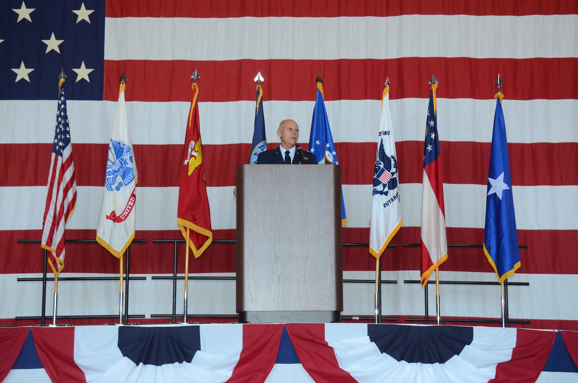 Brig. Gen. Richard Kemble, 94th Airlift Wing commander, welcomes attendees at this year's Academy Day at Dobbins Air Reserve Base, Ga. April 28, 2018. The event is hosted by U.S. Sen. Johnny Isakson, and is the largest of its kind in the country. (U.S. Air Force photo/Don Peek)