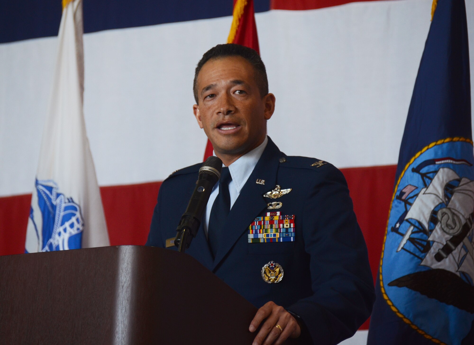 Col. Arthur Primas, U.S. Air Force Academy director of admissions, speaks to attendees at this year's Academy Day, held at Dobbins Air Reserve Base, Ga. April 28, 2018. He discussed the benefits of attending the Air Force Academy to an audience of nearly 1,000. (U.S. Air Force photo/Don Peek)