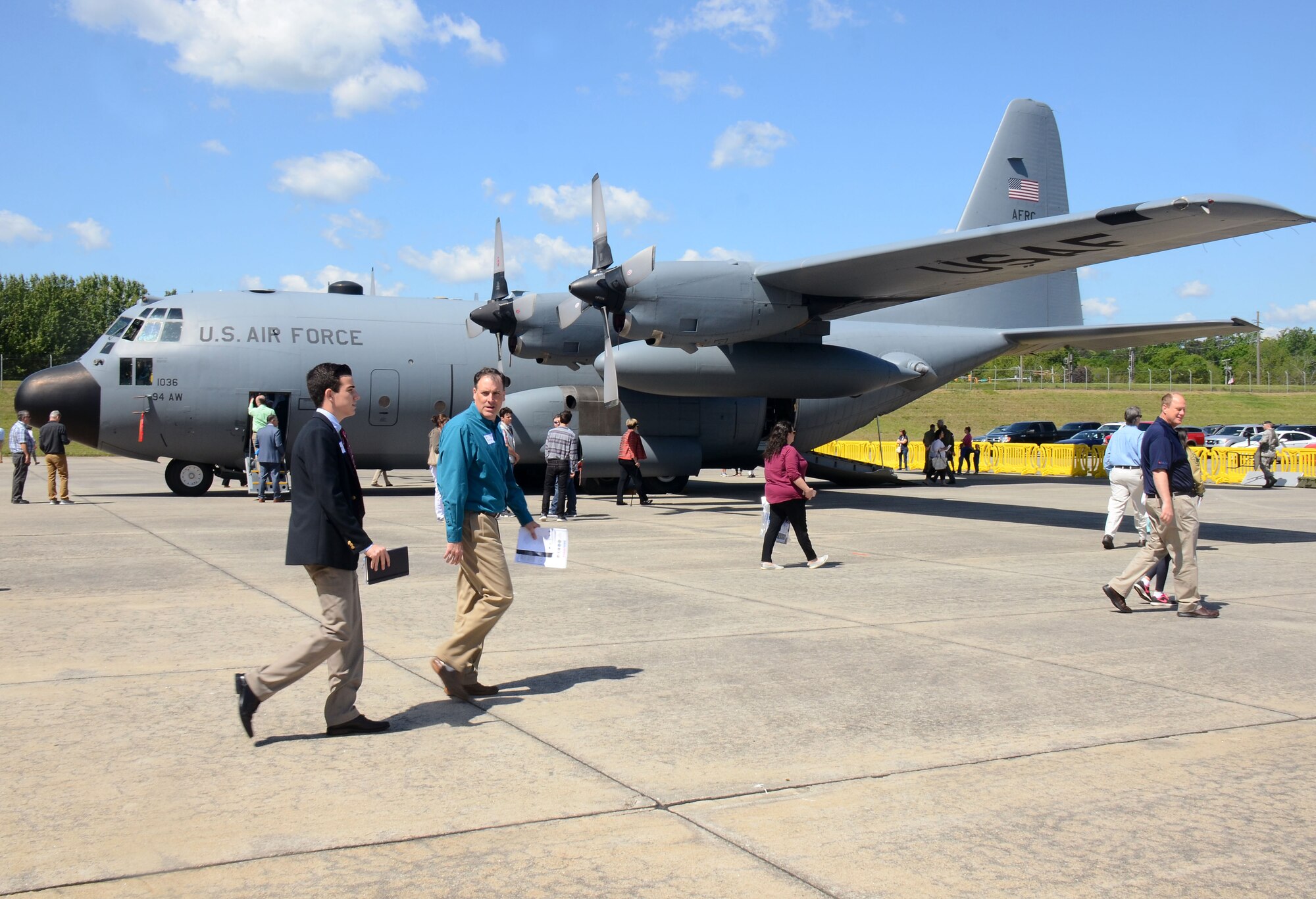 Families walk among static aircraft displays at this year's Academy Day, held at Dobbins Air Reserve Base, Ga. April 28, 2018. Aircraft displays were on hand in addition to guest speakers and academy representatives to give applicants firsthand experience with planes used in the various military branches. (U.S. Air Force photo/Don Peek)