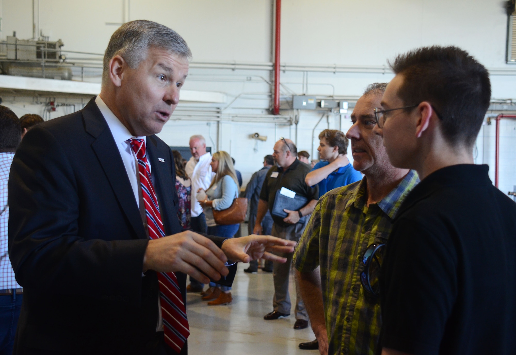 Congressman Rob Woodall talks with a student at this year's Academy Day, held at Dobbins Air Reserve Base, Ga. April 28, 2018. Many attendees got the chance to meet directly with congressional members to learn more about the process for applying to U.S. military academies. (U.S. Air Force photo/Don Peek)