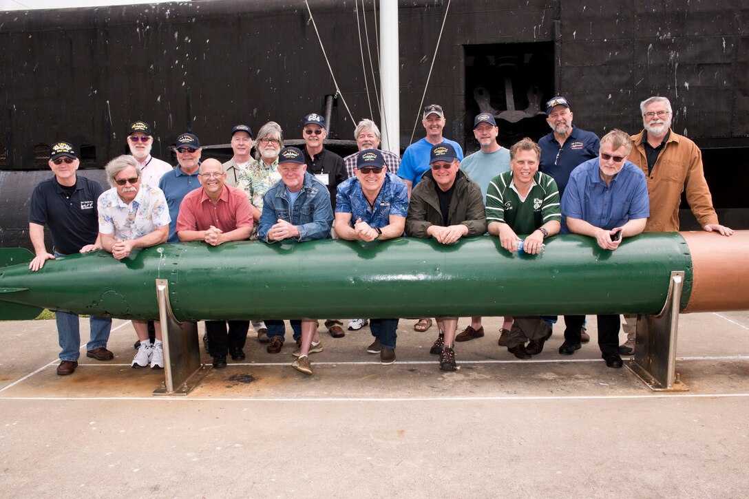 Former crewmembers of the USS Cavalla (SSN 684) pose for a group photo at Seawolf Park in Galveston, Texas, after the “All Cavalla Reunion Memorial Service,” April 21, 2018. The former Sailors gathered for their bi-annual reunion to reconnect, make new friends and honor the memory of those submariners who have passed.