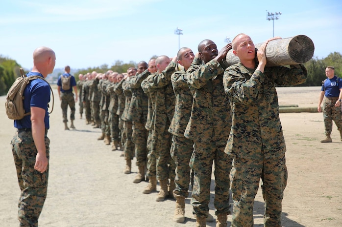 Recruits with Mike Company, 3rd Recruit Training Battalion, carry a log during a log drill exercise at Marine Corps Recruit Depot San Diego, April 23.