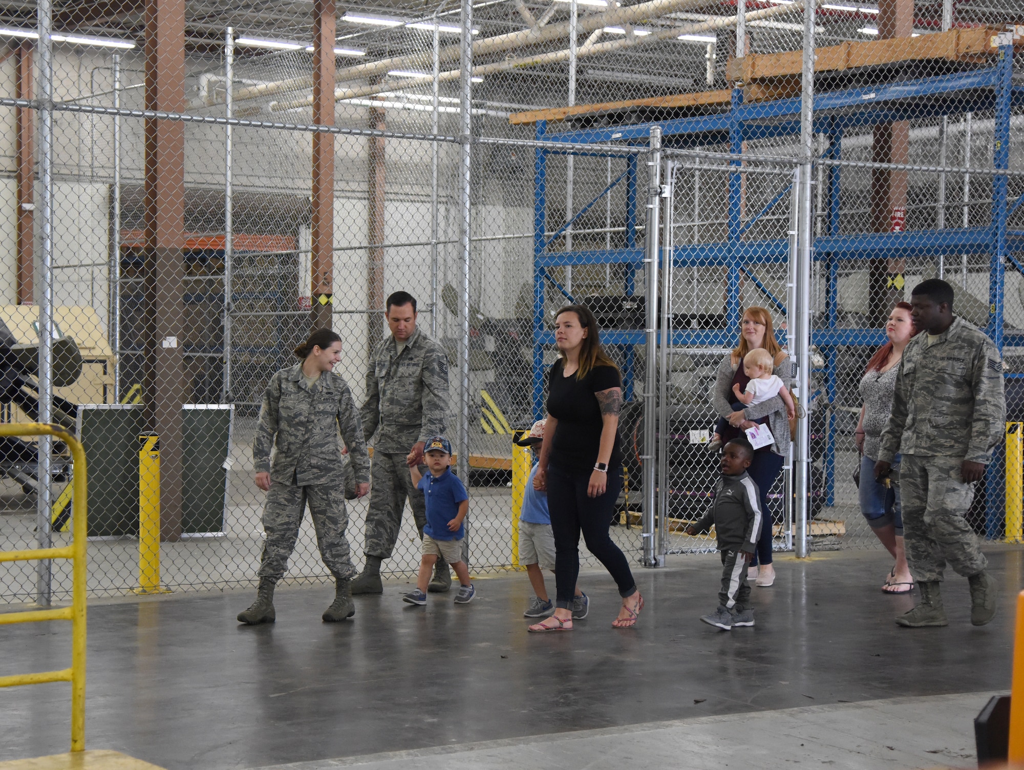 Members of the 81st Logistics Readiness Squadron take their children on a tour of the supply warehouse at the Taylor Logistics Center during the 81st LRS Bring Your Child to Work Day event at Keesler Air Force Base, Mississippi, April 26, 2018. The event allowed children the opportunity to experience what their parents do at work by touring facilities while receiving hands-on experiences. (U.S. Air Force photo by Kemberly Groue)