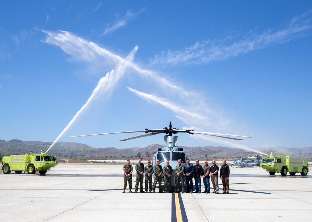 Marines with Marine Aircraft Group 39 pose with personnel from Bell in front of a UH-1Y Venom at Marine Corps Base Camp Pendleton, Calif., April 25. Over a span of 10 years, Bell delivered 160 Venoms across the Marine Corps. Marine Light Attack Helicopter Squadron 469 received their first Venom on Jan. 16, 2007. (U.S. Marine Corps photo by Lance Cpl. Clare J. McIntire/Released)