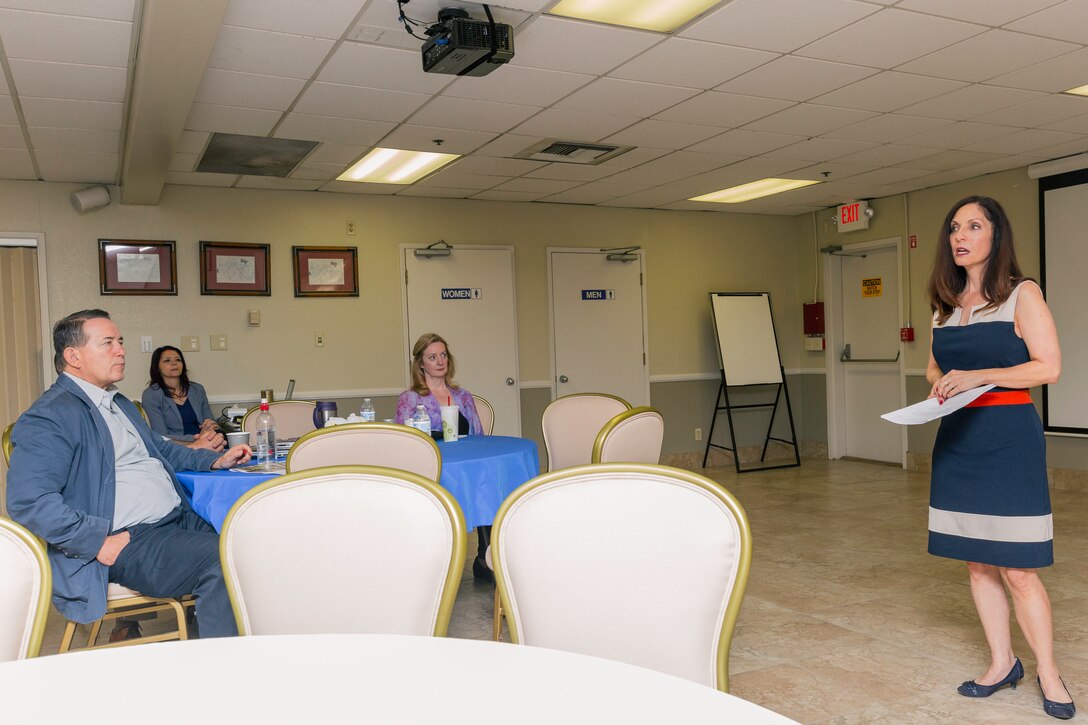 Dawn Herring, who currently works at Marine Corps Base Camp Pendleton as a clinical supervisor in the Community Counseling Center, speaks to civilian employees and Marines in the Major General James L. Day Conference Center aboard Marine Corps Logistics Base Barstow, Calif., April 11.