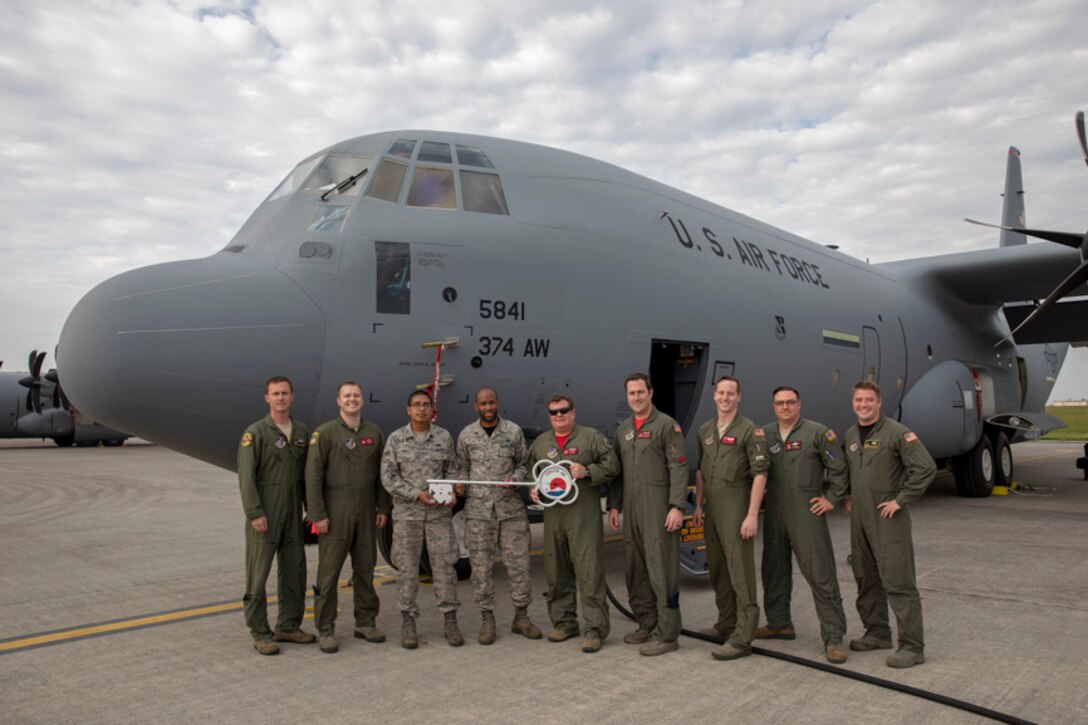 Members of the C-130J Super Hercules number 5843 delivery team pose for a photo