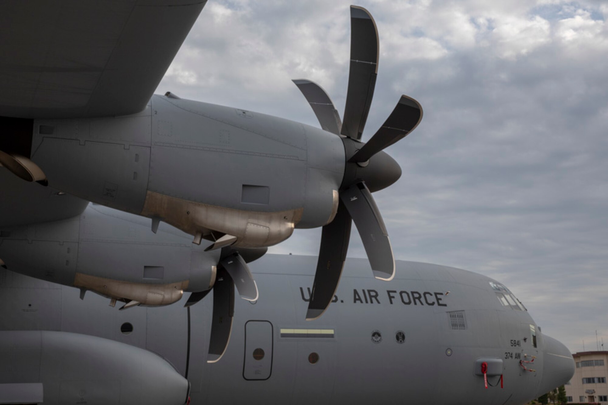 An Air Force C-130J Super Hercules sits on the flightline at Yokota Air Base