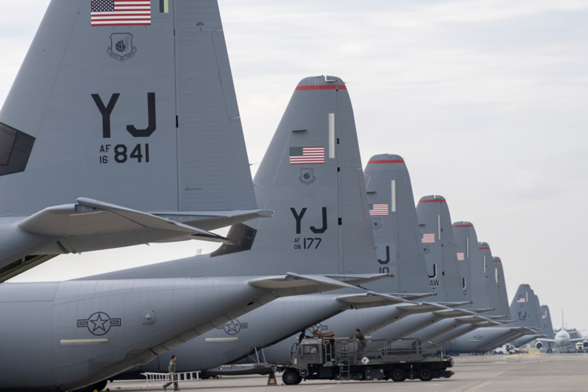 Air Force C-130J Super Hercules aircraft sit on the flightline at Yokota Air Base
