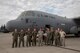 Members of the C-130J Super Hercules number 8610 delivery team pose for a photo
