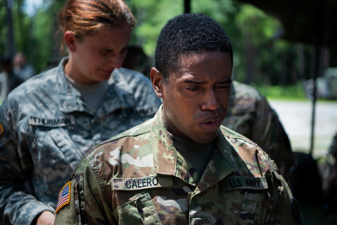 A soldier experiences the after effects a gas chamber exercise.