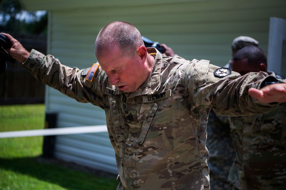 A soldier feels the after effects of the gas chamber training.