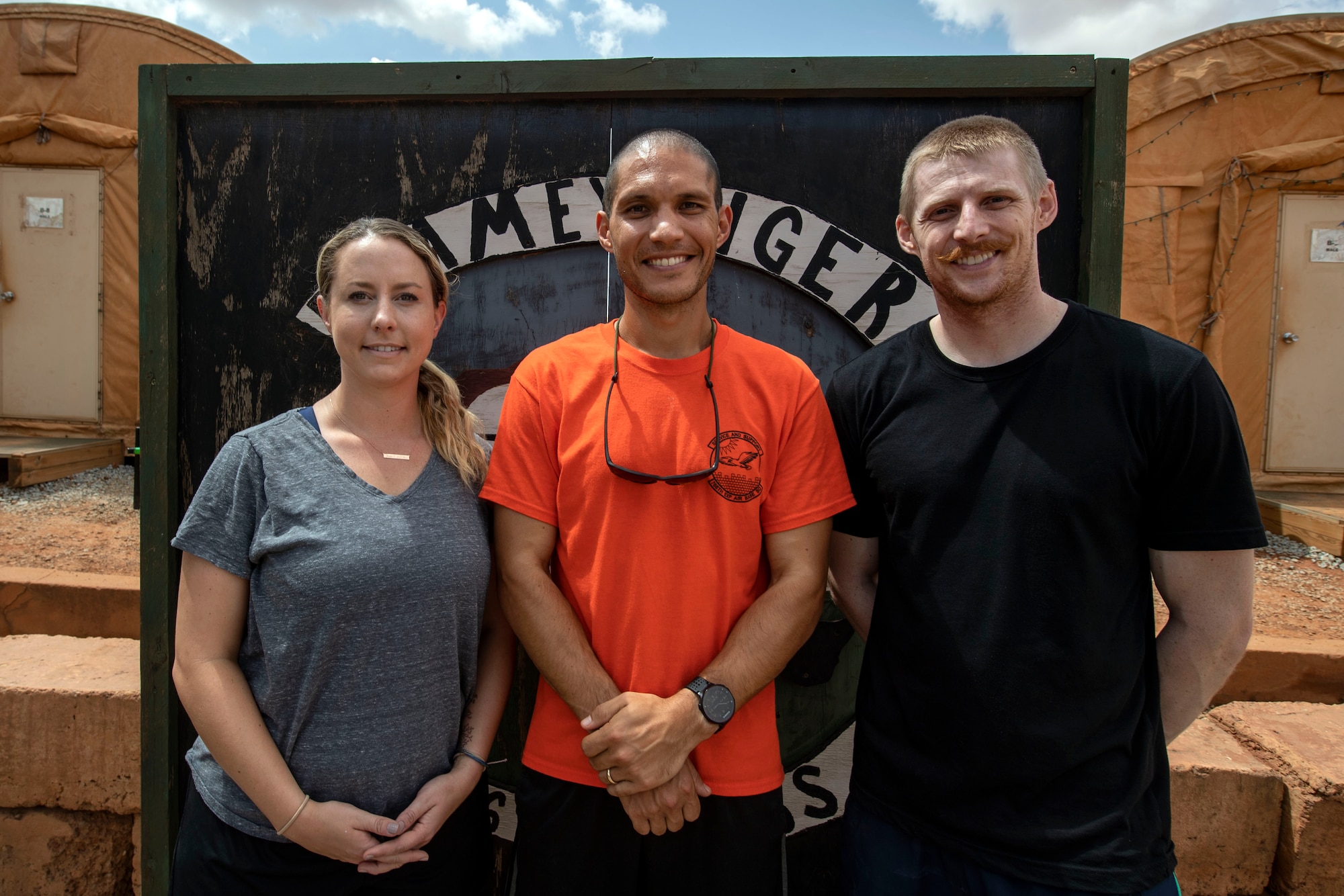 U.S. Air Force Capt. Melanie Gates, left, Capt. Nick McKenzie, and Capt. Richard Thorsted, all who are Special Operations Command Forward Northwest Africa ground surgical team members, gather for a photo at Nigerien Air Base 101, Niamey, Niger, on June 21, 2018. The three doctors recently finished medical school and are serving their first deployment. They are deployed from Travis Air Force Base, California.  (U.S. Air Force courtesy photo)