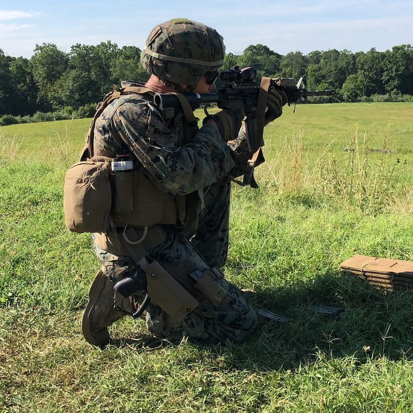 A Marine from 4th platoon, Charlie Co.,  Fleet Anti-terrorism Security Team, U.S. Marine Corps Security Forces, conducts unknown distance live fire evolution aboard Marine Corps Base Quantico July 25.  Marines additionally utilized various standard and non-standard shooting positions to simulate engaging targets from various pieces of terrain and cover that would be located throughout the battlespace. (Official U.S. Marine Corps photo by Capt. John McCourt/Released)