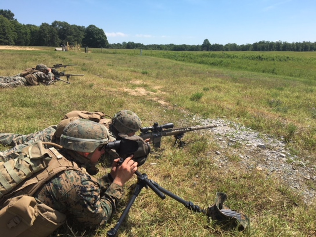 A Designated marksman from 4th platoon, Charlie Co.,  Fleet Anti-terrorism Security Team, U.S. Marine Corps Security Forces conduct live fire training at unknown distances utilizing their M110 SASS and SSOT to identify targets at various distances and provide precision marksmanship Marine Corps Base Quantico July 25.  Marines additionally utilized various standard and non-standard shooting positions to simulate engaging targets from various pieces of terrain and cover that would be located throughout the battlespace. (Official U.S. Marine Corps photo by Capt. John McCourt/Released)