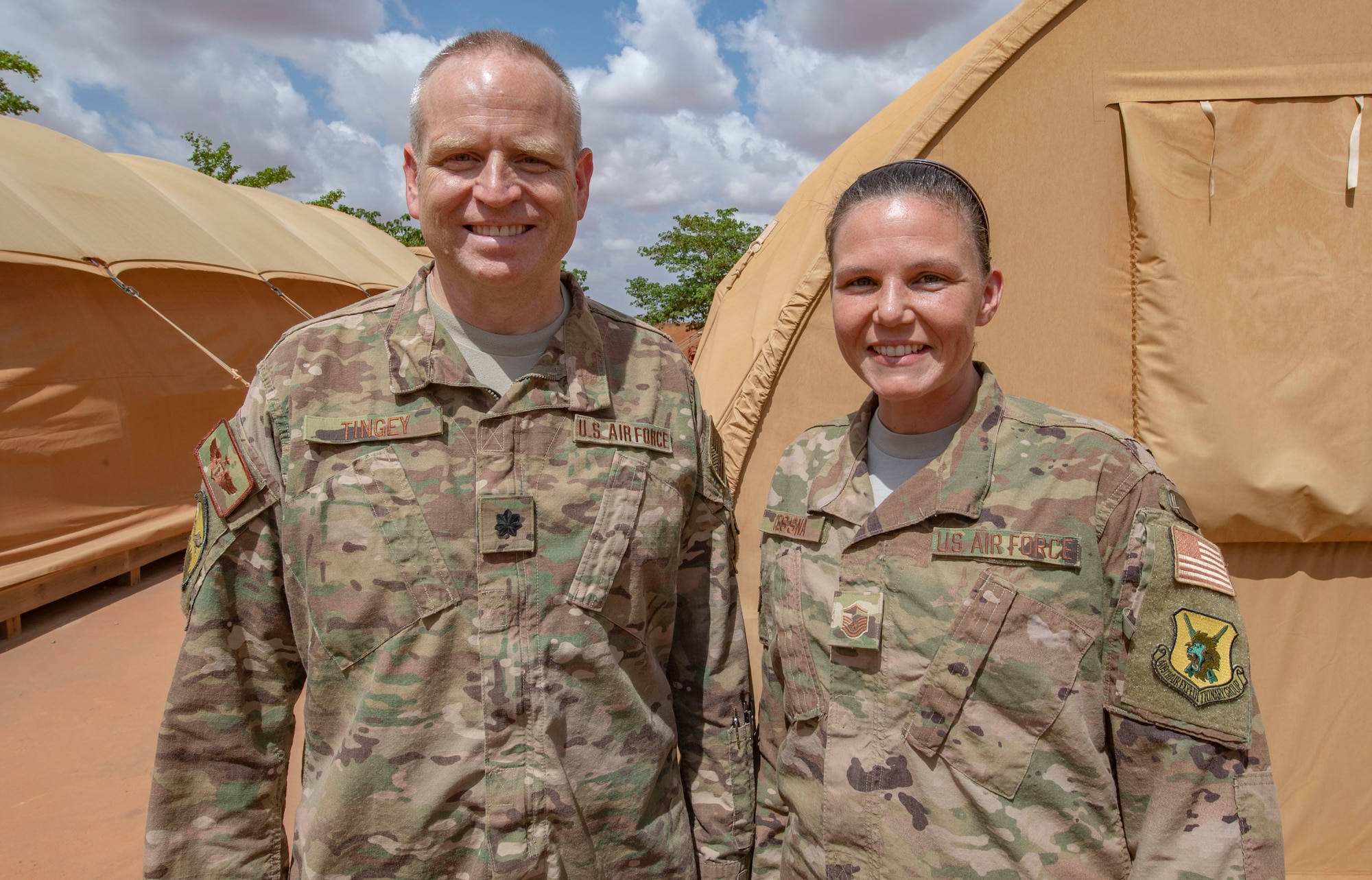 Lt. Col. Justin Tingey, 768th Expeditionary Air Base Squadron flight doctor, and Master Sgt. Melissa Cessna, 768th EABS independent duty medical technician, pose for a photo at Nigerien Air Base 101, Niamey, Niger, on June 21, 2018. The team recently set up a walking blood bank to enable life-saving surgery to an Italian woman who nearly died in a car accident outside the base. The patient is now in good condition and recovering in Italy. (U.S. Air Force courtesy photo)