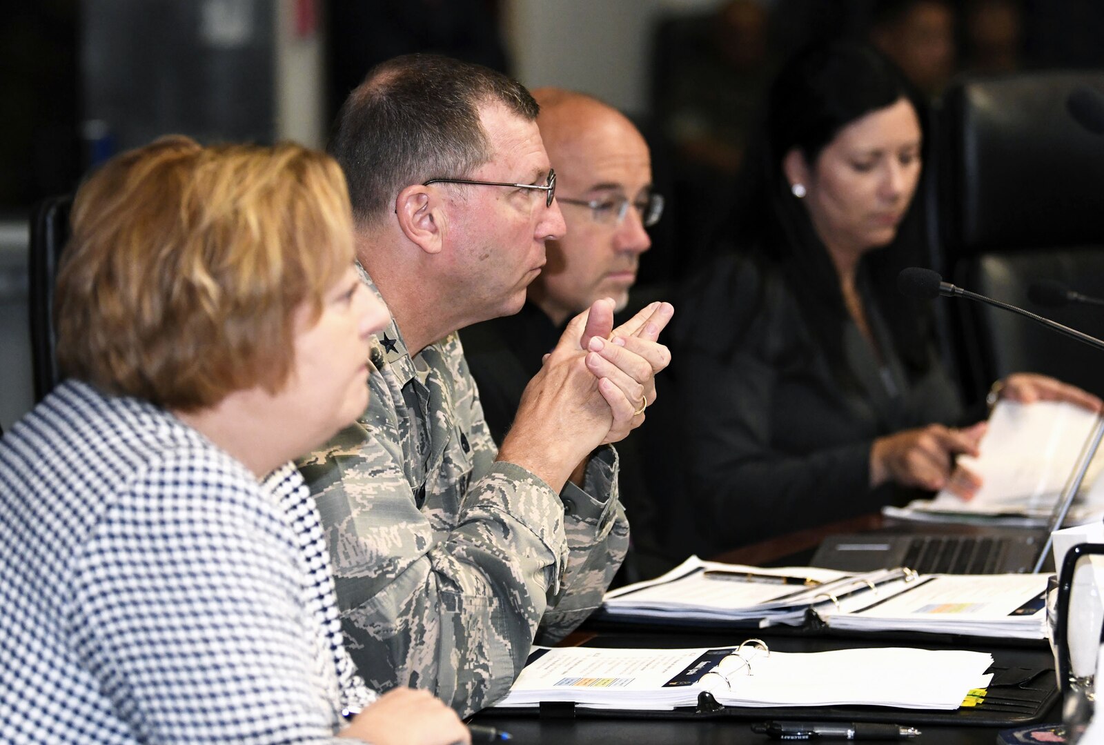 Jan Mulligan, Deputy Assistant Secretary of Defense for Supply Chain Integration, left sits with DLA Logistics Operations Director Air Force Maj. Gen. Mark Johnson and DLA Logistics Operations Deputy Director Mike Scott at the  the first Service Readiness Demand Planning Summit, July 12.