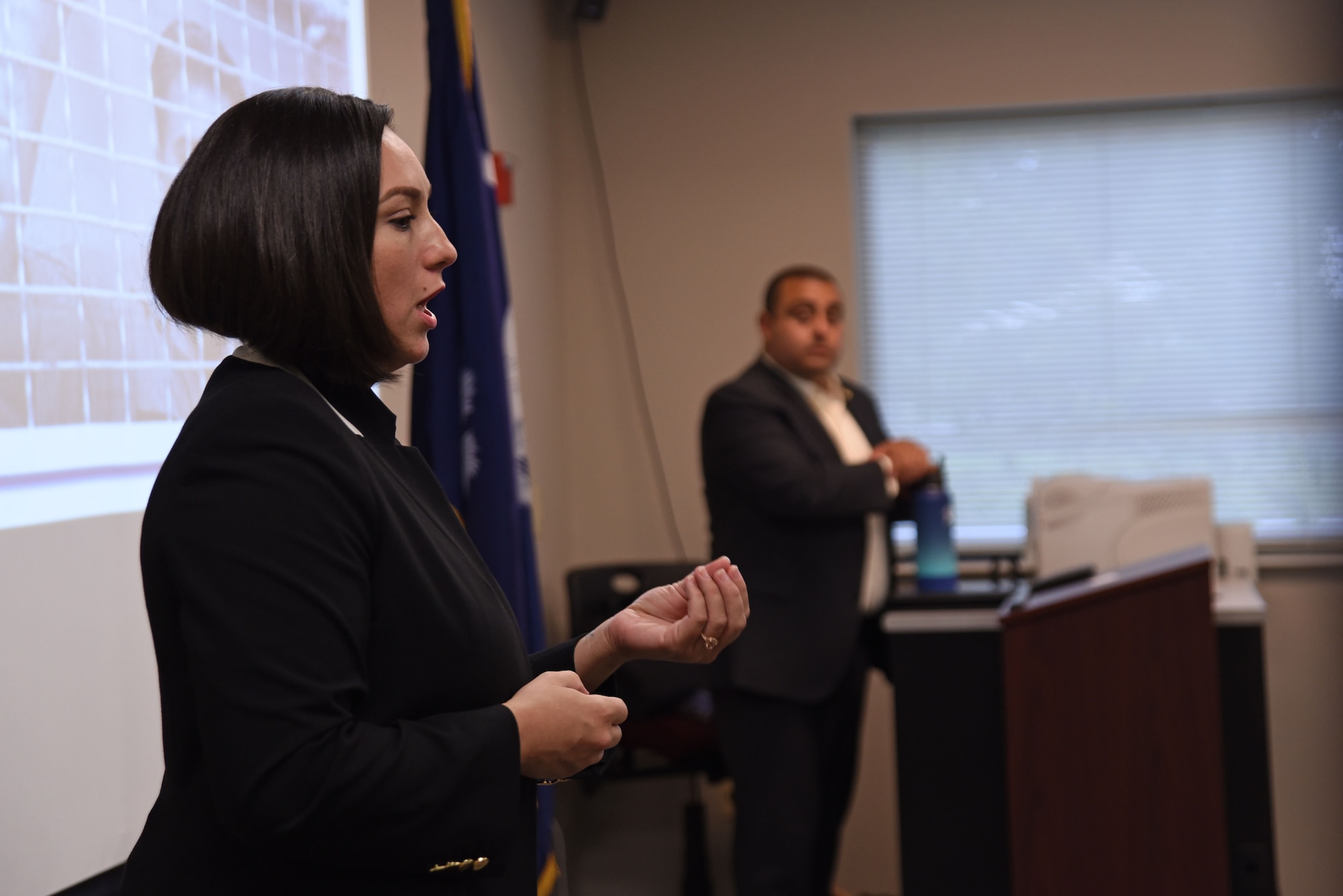 U.S. Air Force Special Agent Linzi Joseph, Headquarters Air Force Office of Special Investigations recruiting and applicant processing team member, speaks to Airmen during a recruiting team visit to the Spratt Education Center at Shaw Air Force Base, S.C., July 30, 2018.