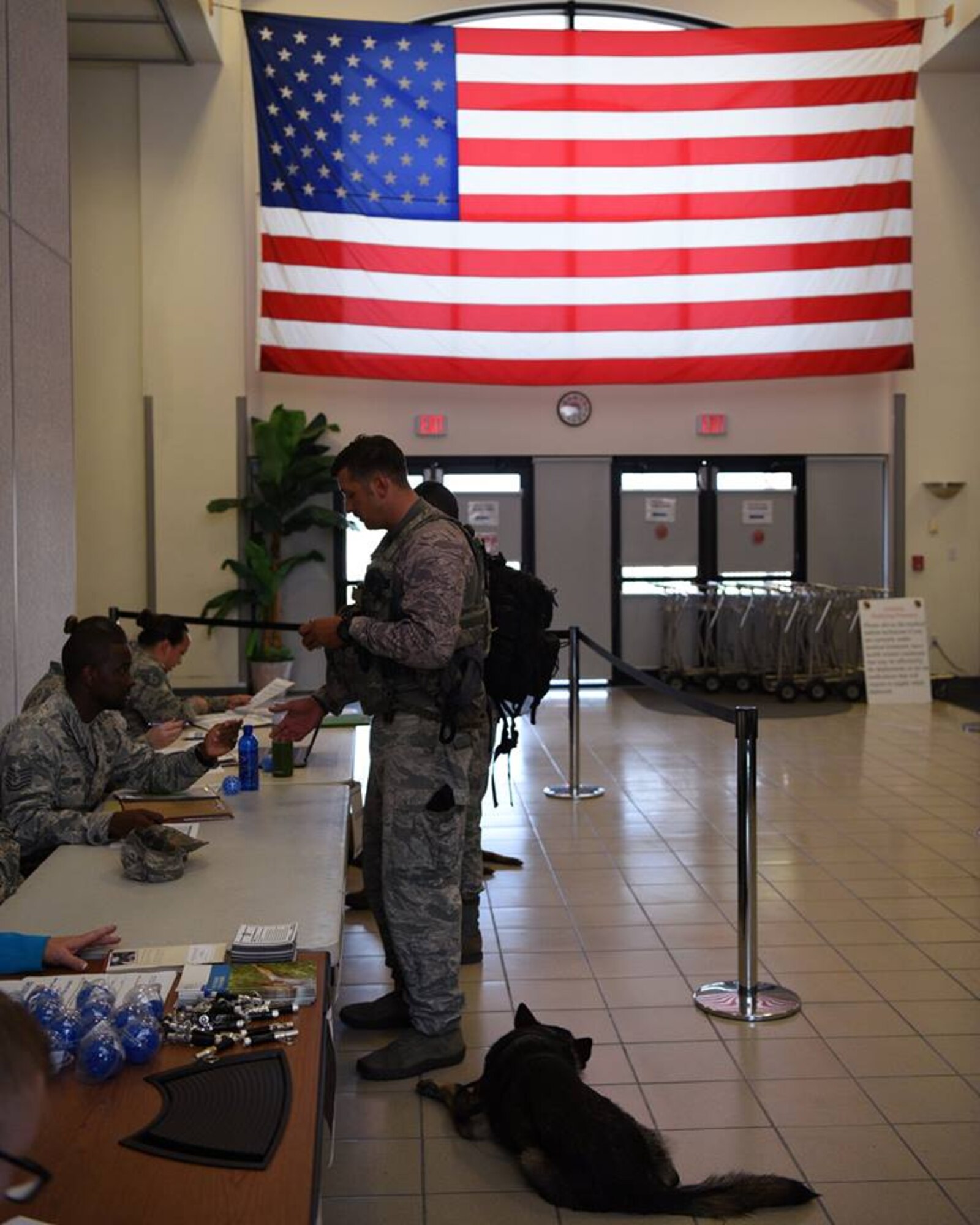 Staff Sgt. Jeremy Rice, a K-9 handler from the 45th Security Forces Squadron, goes through the pre-deployment line July 17, 2018, at Patrick Air Force Base, Fla. Rice was accompanied by his military working dog, Dome. (U.S. Air Force photo by Airman 1st Class Zoe Thacker)