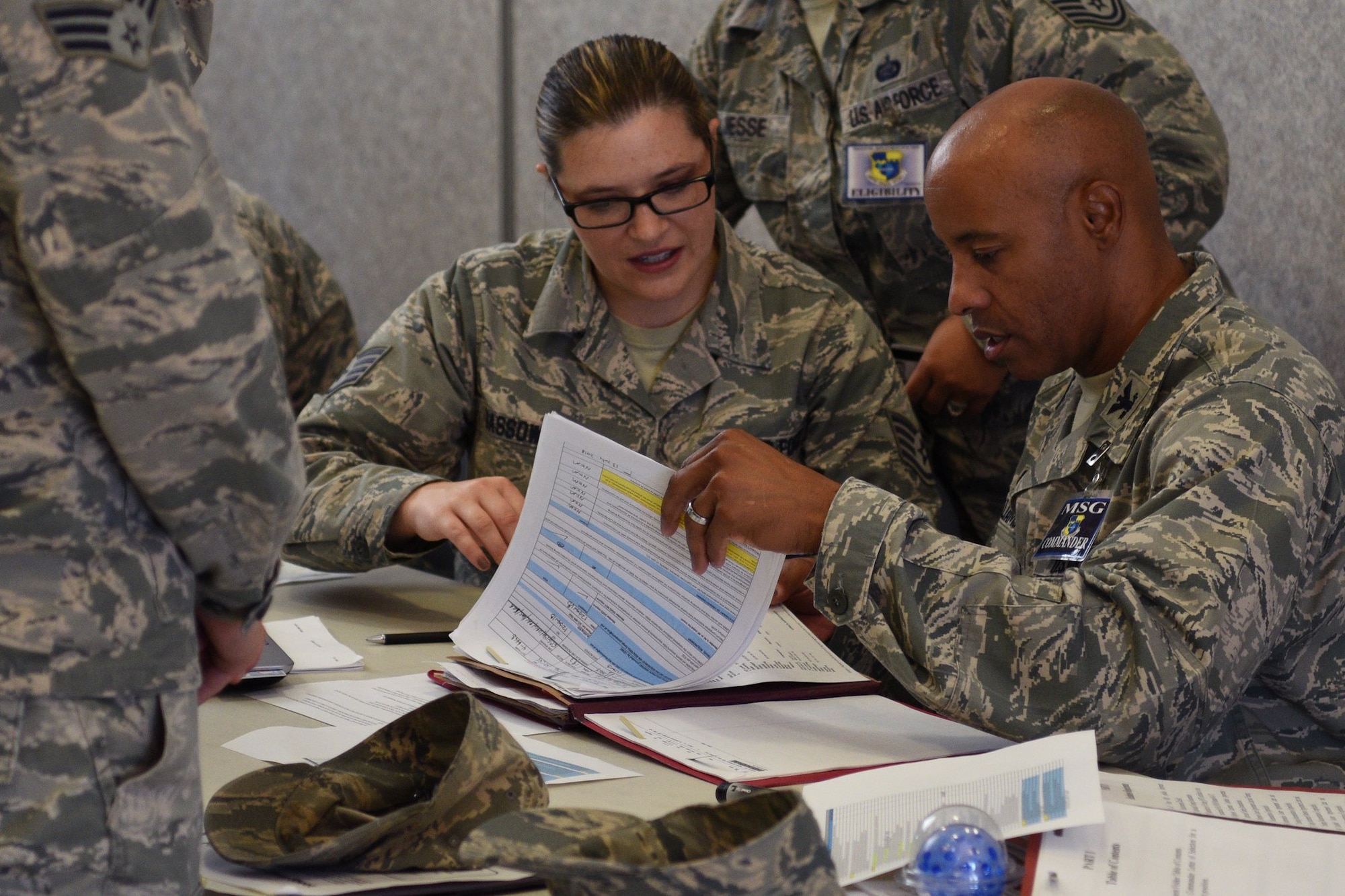 Col. Kevin Williams, commander of the 45th Mission Support Group, goes over the process of the pre-deployment line July 17, 2018, at Patrick Air Force Base, Fla. The pre-deployment line was set up to streamline deployment out processing for Airmen on base. (U.S. Air Force photo by Airman 1st Class Zoe Thacker)