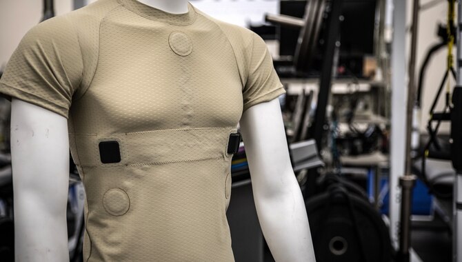 Air Force researchers from the 711th Human Performance Wing at Wright-Patterson Air Force Base, Ohio, test a compression undershirt called PHYSIO, which allows continuous monitoring of aircrews. The compression shirt monitors multiple vital signs while in flight. (U.S. Air Force photo by Richard Eldridge)
