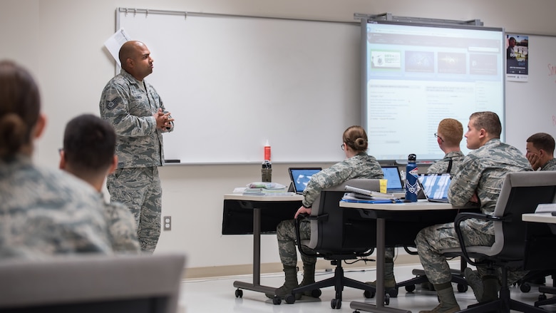 Tech. Sgt. Ricardo Lemos Rodriguez, noncommissioned officer in charge of the Force Health Management Branch, mentors the Public Health apprentice students to prepare them for the operational Air Force. He discusses how they can navigate the Air Force Portal to locate information on Air Force priorities, career development and education. (U.S. Air Force photo by Richard  Eldridge)