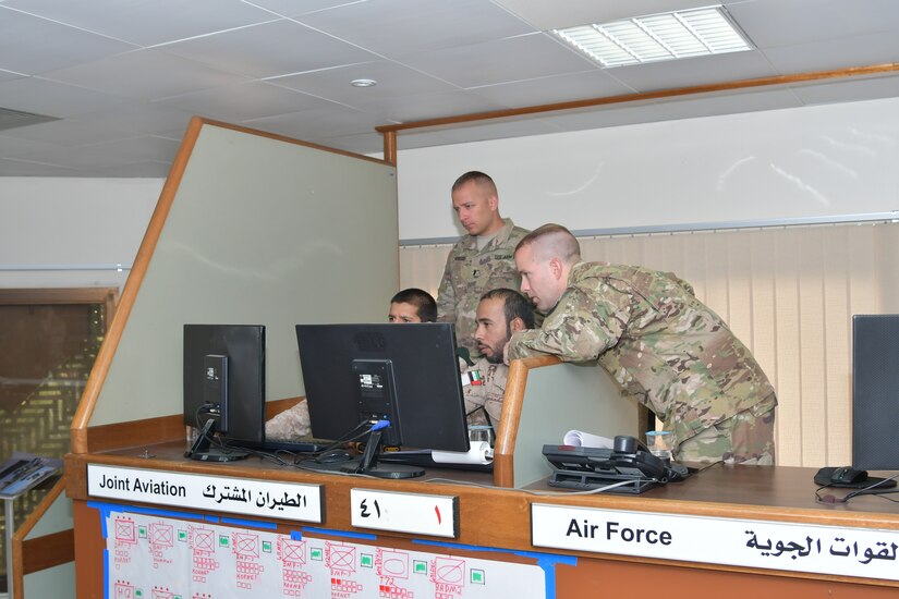 Soldiers with Task Force Spartan and the United Arab Emirates Land Force Component discusses courses of action during the Iron Union 7 exercise July 9, 2018. The exercise brought together U.S. and Emirati soldiers to improve coordination and communication.