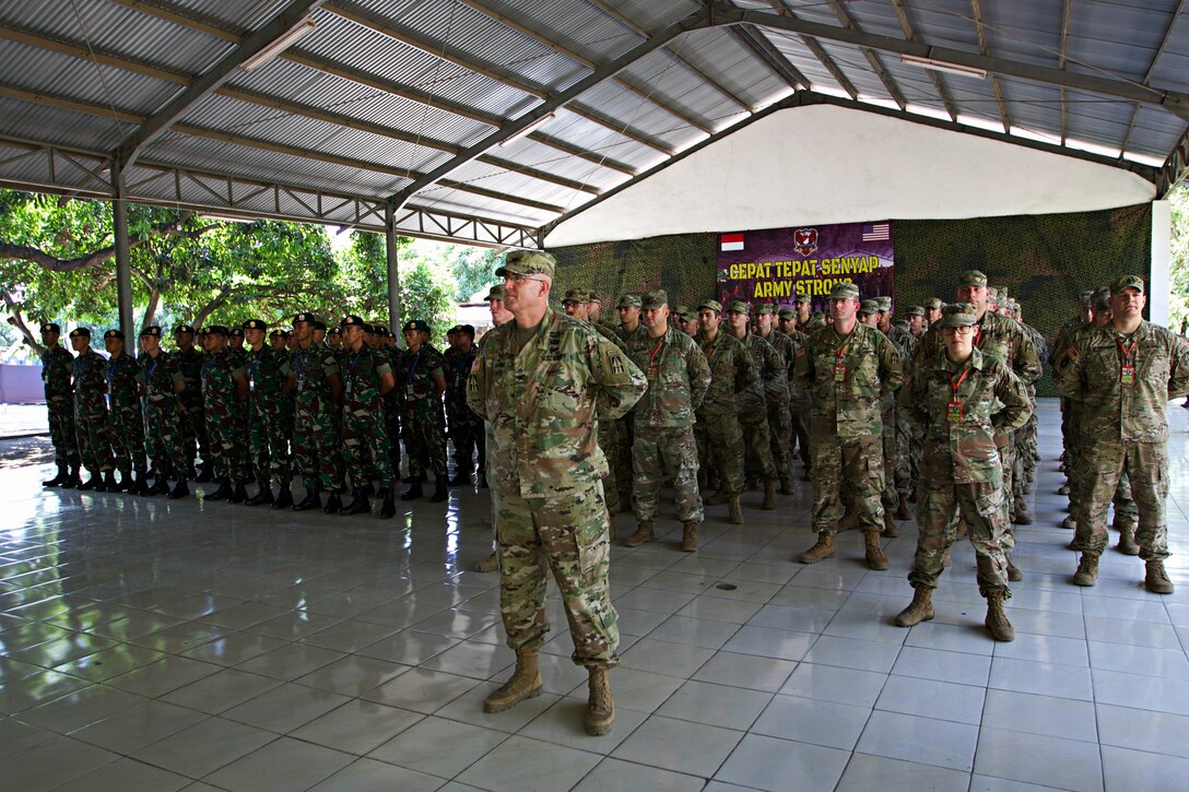 Indiana Army National Guardsmen from the 76th Infantry Brigade Combat Team stand in formation with their Indonesian army counterparts during the opening ceremony for Exercise Garuda Shield 18 in Puslatpur, Indonesia, July 29, 2018. Garuda Shield 18 is the third exercise in U.S. Army Pacific’s second iteration of Pacific Pathways, a series of multinational engagements with ally and partner militaries in the Indo-Pacific region. Army photo by Spc. Joshua Syberg
