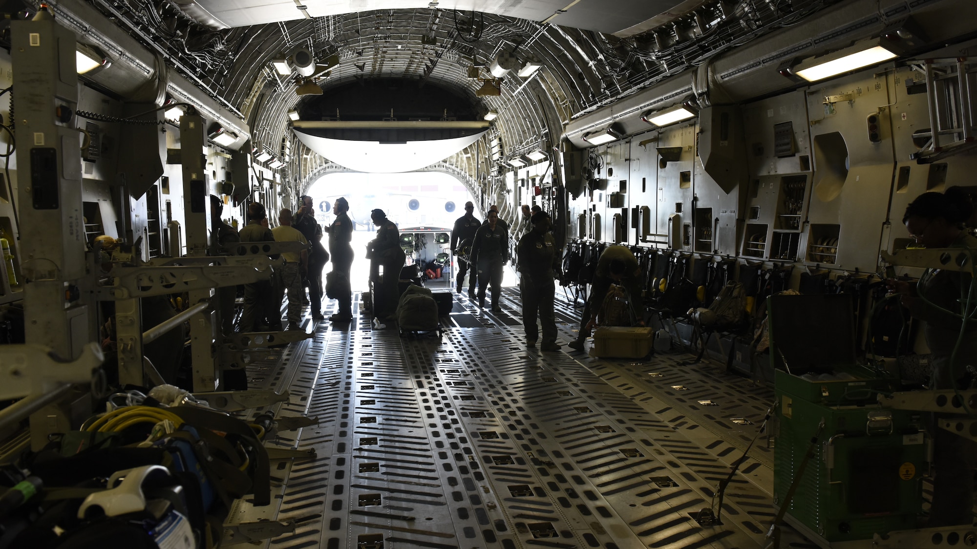 Airmen from the 156th Aeromedical Evacuation Squadron load medical equipment aboard a C-17 Globemaster III aircraft, at North Carolina Air National Guard Base, Charlotte Douglas International Airport, July 9, 2018. (U.S. Air Force photo by Tech. Sgt. Nathan Clark)