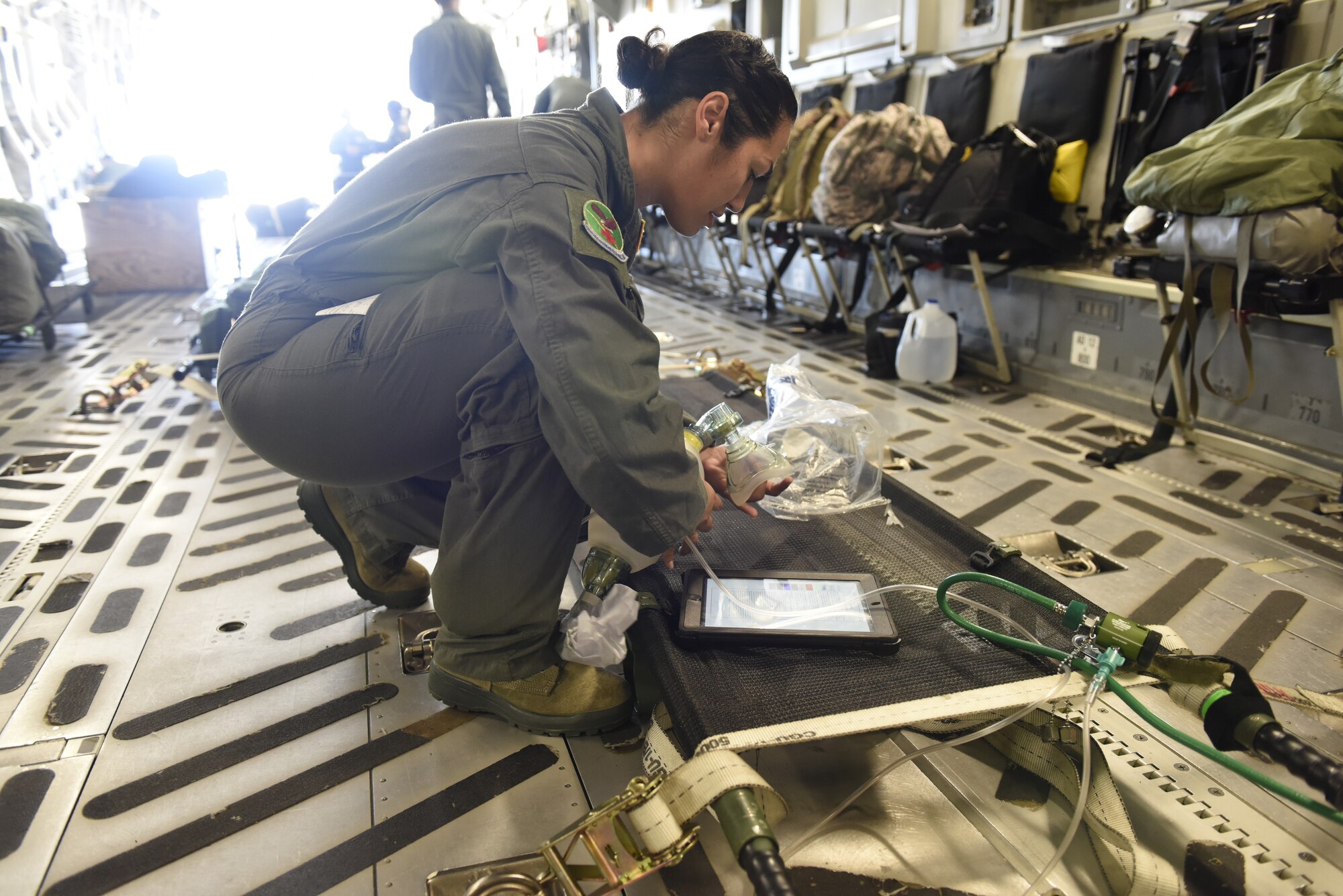 U.S. Air Force Airman 1st Class Kiara Rivera Cortes, 156th Aeromedical Evacuation Squadron, checks medical equipment aboard a C-17 Globemaster III aircraft prior to takeoff at the North Carolina Air National Guard Base, Charlotte Douglas International Airport, for transport to Volk Field Air National Guard Base, Wisconsin, for a training exercise, July 9, 2018. (U.S. Air Force photo by Tech. Sgt. Nathan Clark)