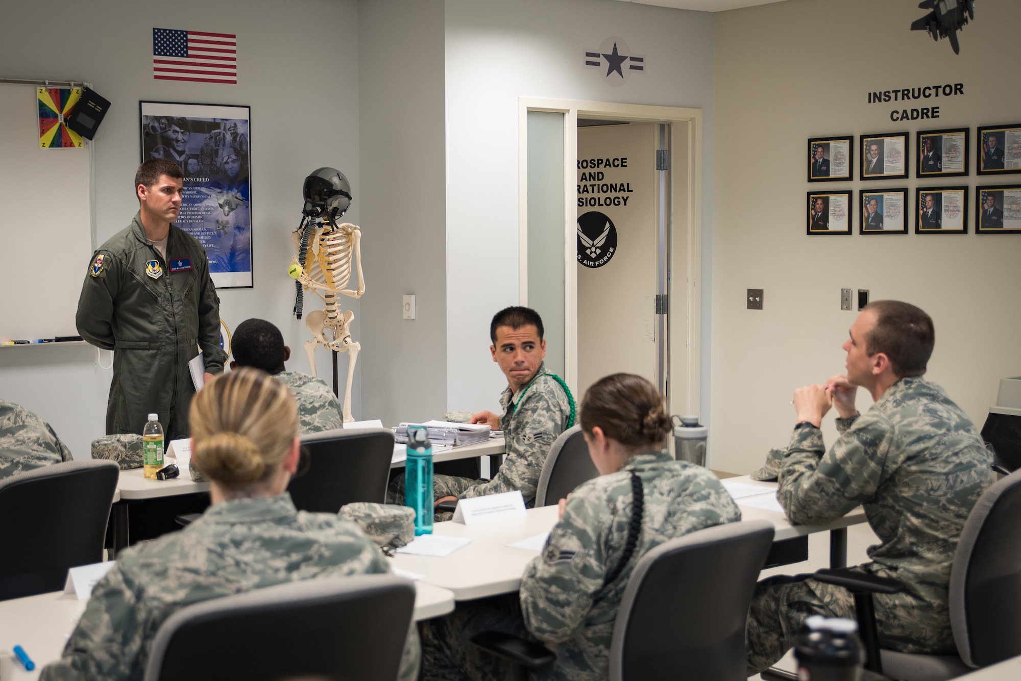 Staff Sgt. William Ensrud, aerospace physiology technician and assistant course director for aerospace and operational physiology apprentice course, listens to a student’s question during the course. (U.S. Air Force photo by Richard  Eldridge)
