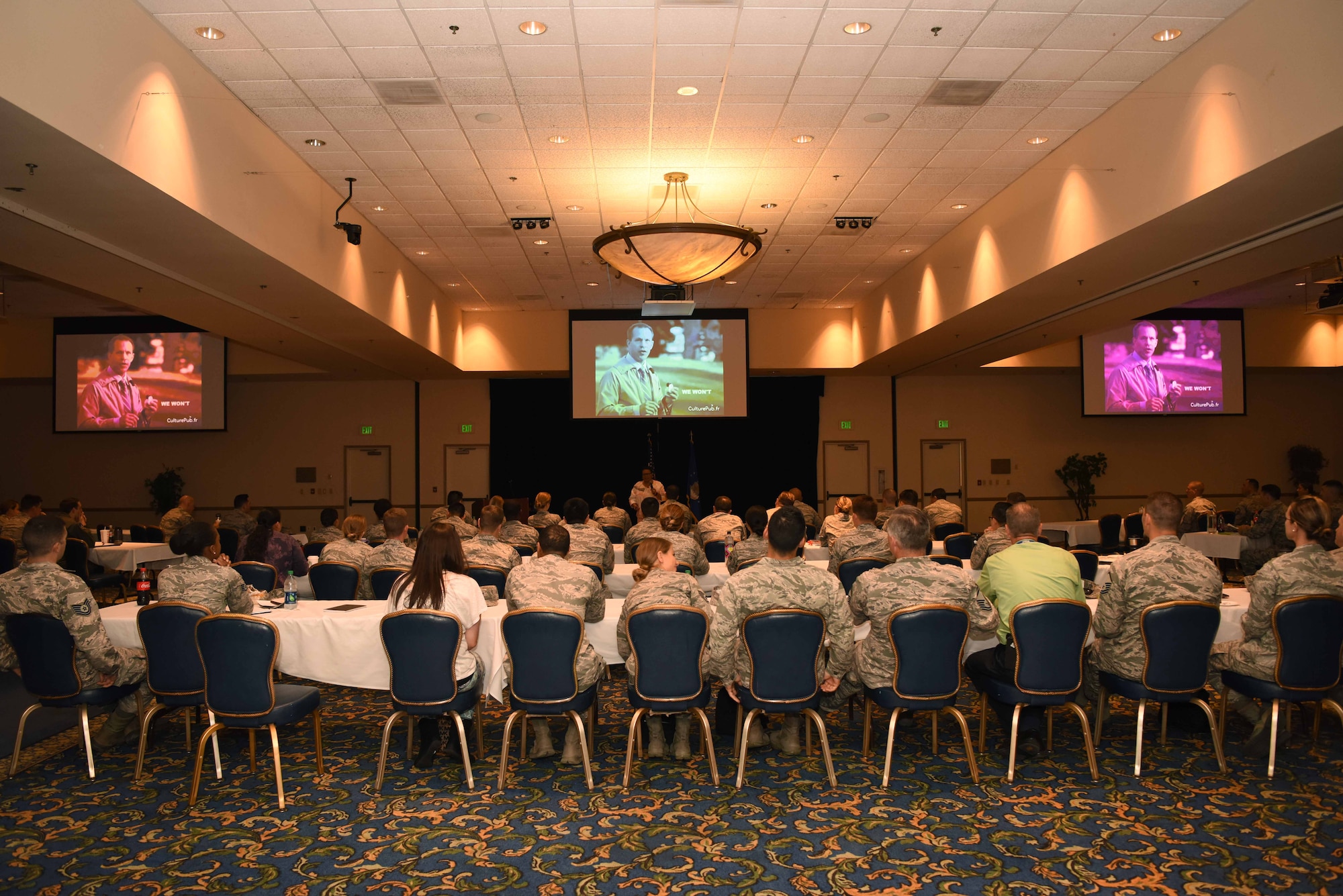 Airmen watch a video during the Enhancing Human Capital Course July 27, 2018, at the Pacific Coast Club on Vandenberg Air Force Base, Calif. The course is a seven-hour long program designed to help Airmen with their personal and professional development. (U.S. Air Force photo by Airman 1st Class Hanah Abercrombie/Released)
