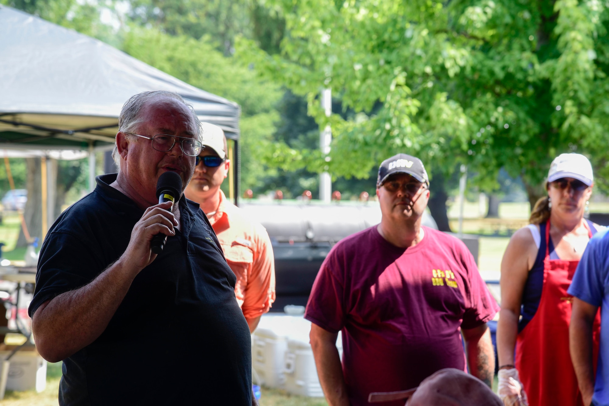 ‘Uncle’ Leroy Payne, local Spokane pit master, speaks with Airmen July 28, 2018, at Fairchild Air Force Base, Washington. Payne and his team composed of military veterans, their families and friends, cooked more than 150 smoked rib racks, 300 pounds of pulled pork and various side dishes to show appreciation for Fairchild Airmen. (U.S. Air Force photo/Staff Sgt. Nick Daniello)