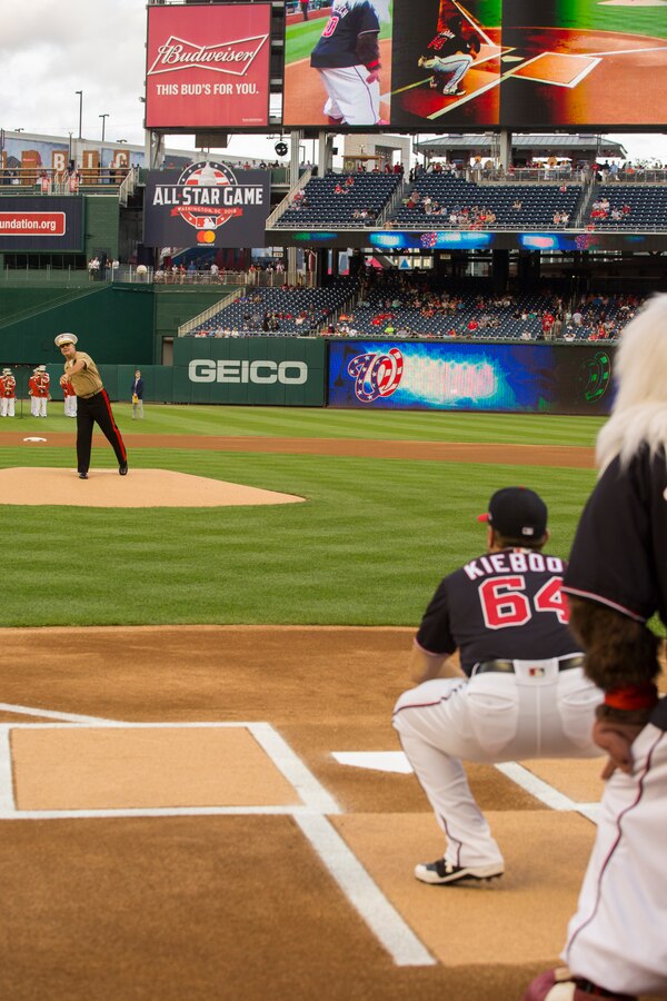 Major Gen. John R. Ewers Jr., staff judge advocate to the Commandant of the Marine Corps, throws the first ceremonial pitch during U.S. Marine Corps Day at Nationals Park, Washington D.C., July 31, 2018. The Washington Nationals hosted Marines stationed around the National Capital Region to participate in pre-game events to honor the Marine Corps. (Official U.S. Marine Corps photo by Sgt. Robert Knapp/Released)