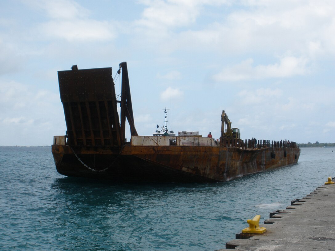A second, larger barge arrives to collect the bulk of the 6 million pounds of scrap.