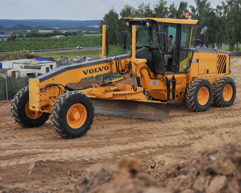 Lt. Col. Robert Wengerter, the commander of the 910th Logistics Readiness Squadron, was in charge of the 910th Airlift Wing Reserve Citizen Airmen who spent annual training in Germany. Wengerter embodied his own rule “Work hard, play hard” by dusting off his old enlisted “Dirt boy” training and hopping in a motor grader to level off a beaten up path on the 52nd CES yard.