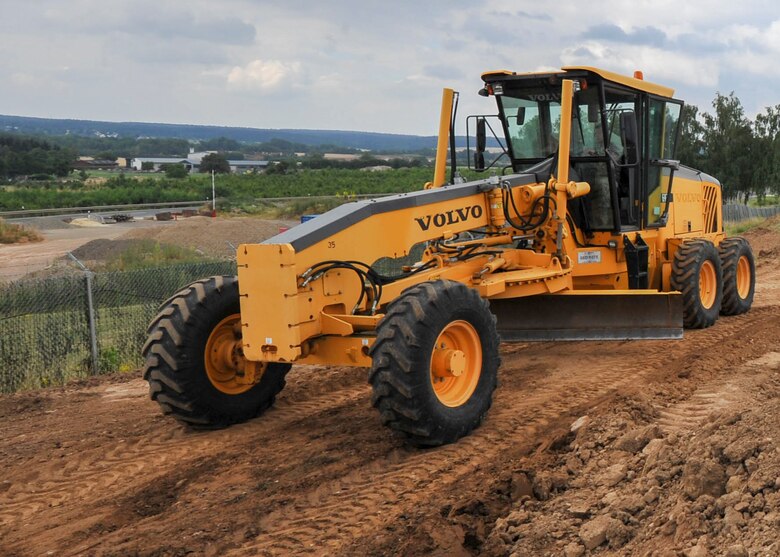 Lt. Col. Robert Wengerter, the commander of the 910th Logistics Readiness Squadron, was in charge of the 910th Airlift Wing Reserve Citizen Airmen who spent annual training in Germany. Wengerter embodied his own rule “Work hard, play hard” by dusting off his old enlisted “Dirt boy” training and hopping in a motor grader to level off a beaten up path on the 52nd CES yard.