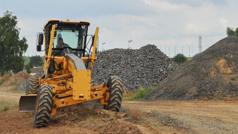 Lt. Col. Robert Wengerter, the commander of the 910th Logistics Readiness Squadron, was in charge of the 910th Airlift Wing Reserve Citizen Airmen who spent annual training in Germany. Wengerter embodied his own rule “Work hard, play hard” by dusting off his old enlisted “Dirt boy” training and hopping in a motor grader to level off a beaten up path on the 52nd CES yard.