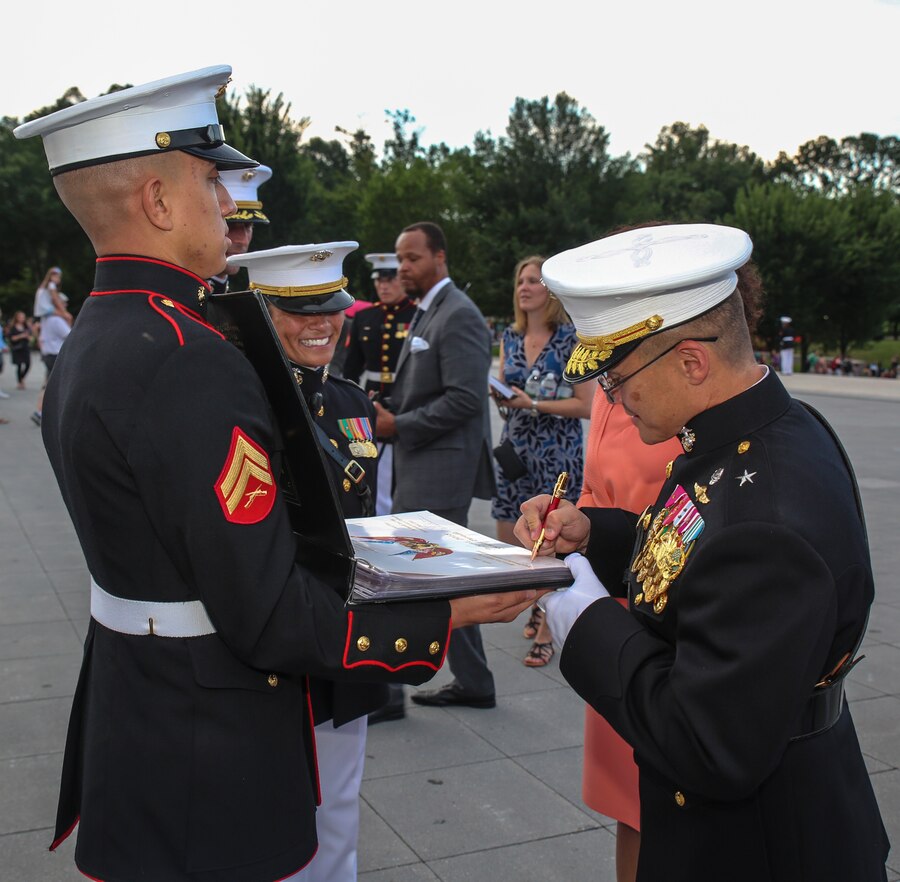 Brigadier Gen. William Seely III, director, Office of Marine Corps Communications, signs the official guestbook after a Tuesday Sunset Parade at the Lincoln Memorial, Washington D.C., July 31, 2018. The guest of honor for the parade was Dana White, assistant to the Secretary of Defense for Public Affairs, and the hosting official was Brig. Gen. Seely III. (Official U.S. Marine Corps Photo by Cpl. Damon Mclean/Released)