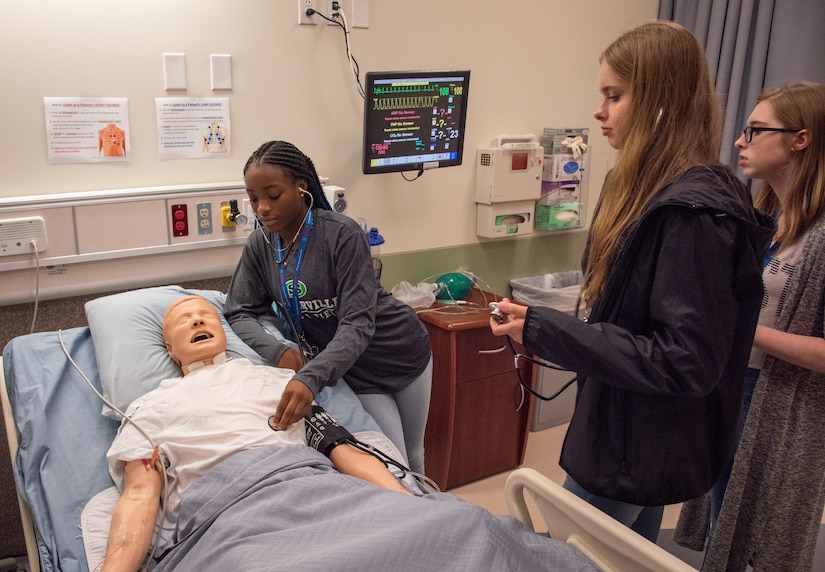 Attendees from the seventh annual Girls Day Out get hands-on experience with medical professionals during a learning session July 26, 2018, at Trident Technical College.